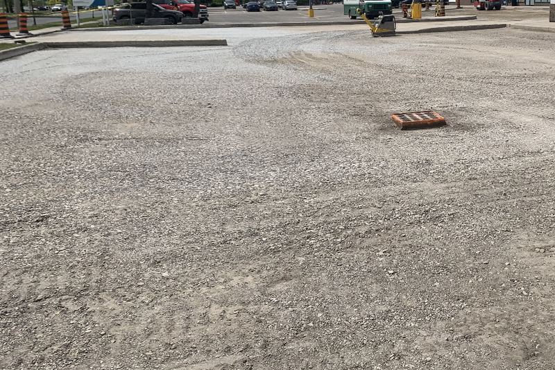 Our team's work: granular base graded across a plaza lot